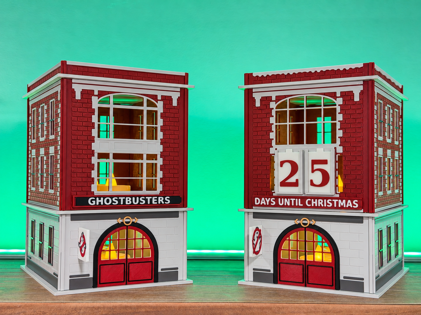 Two original 3D-printed firehouse models with illuminated windows and a Christmas countdown